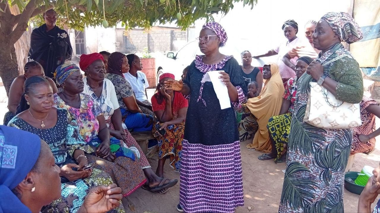 A speaker addressing a gathering of women during the Diamond Project outreach